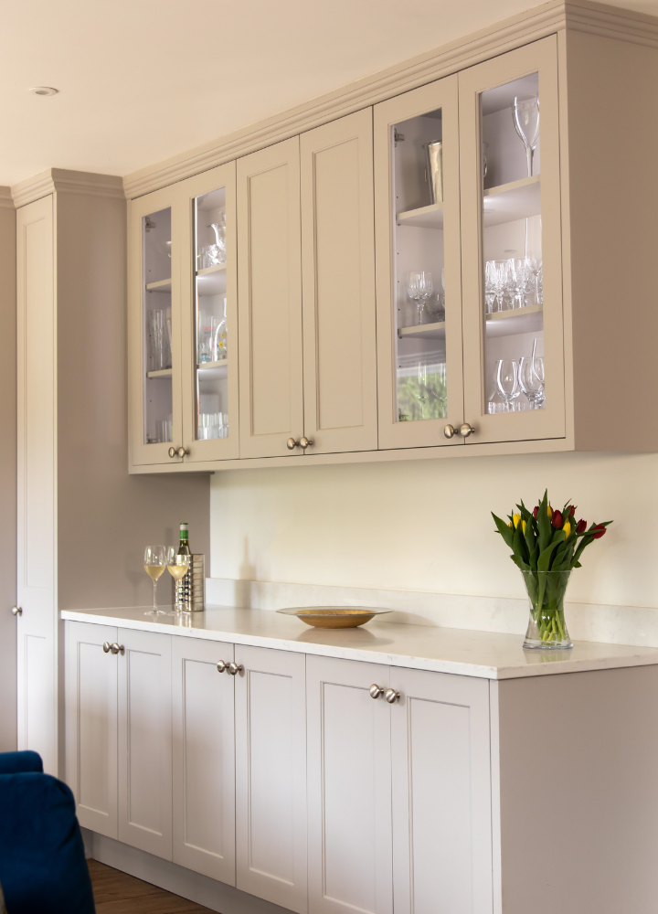 Cream built-in display cabinet with glazed and Plain Shaker doors