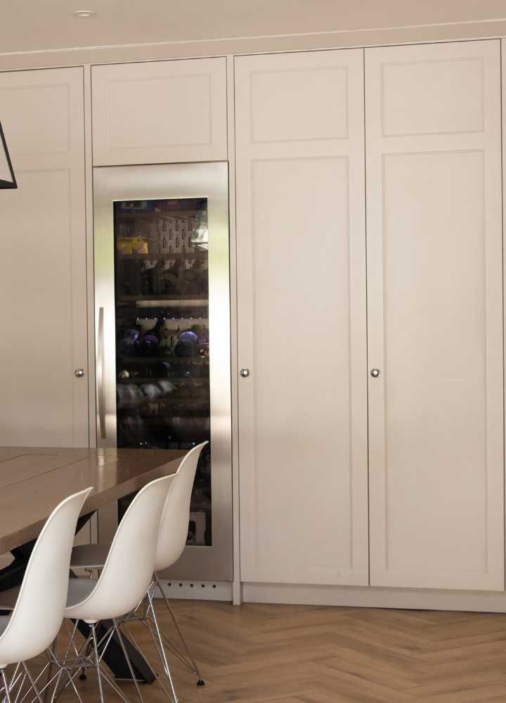 White fitted kitchen and dining cabinetry with Plain Shaker doors