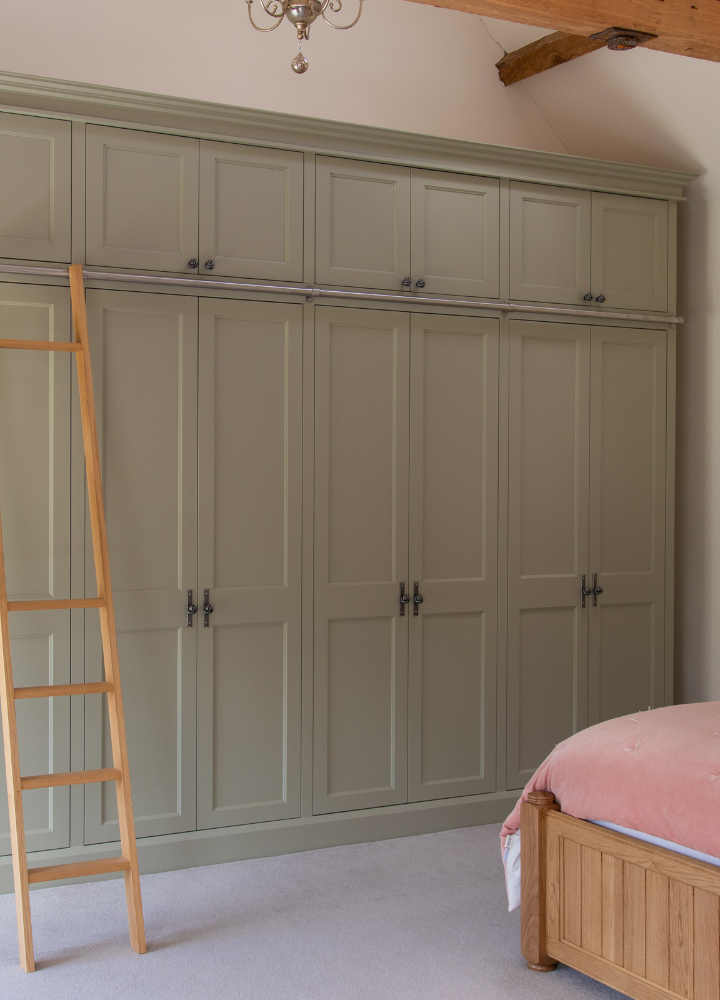 Large bedroom wardrobe wall with tall Plain Shaker doors and midrails