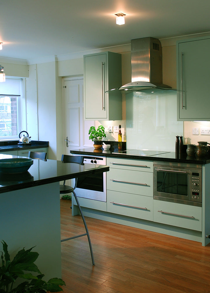 White fitted wardrobe wall with tall Plain Shaker doors
