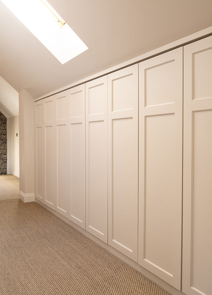 White hallway storage fitted with tall made-to-measure Plain Shaker doors