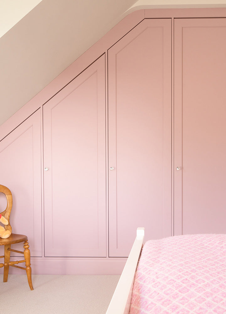 Cream customer kitchen with decorative horizontal panel cabinet doors