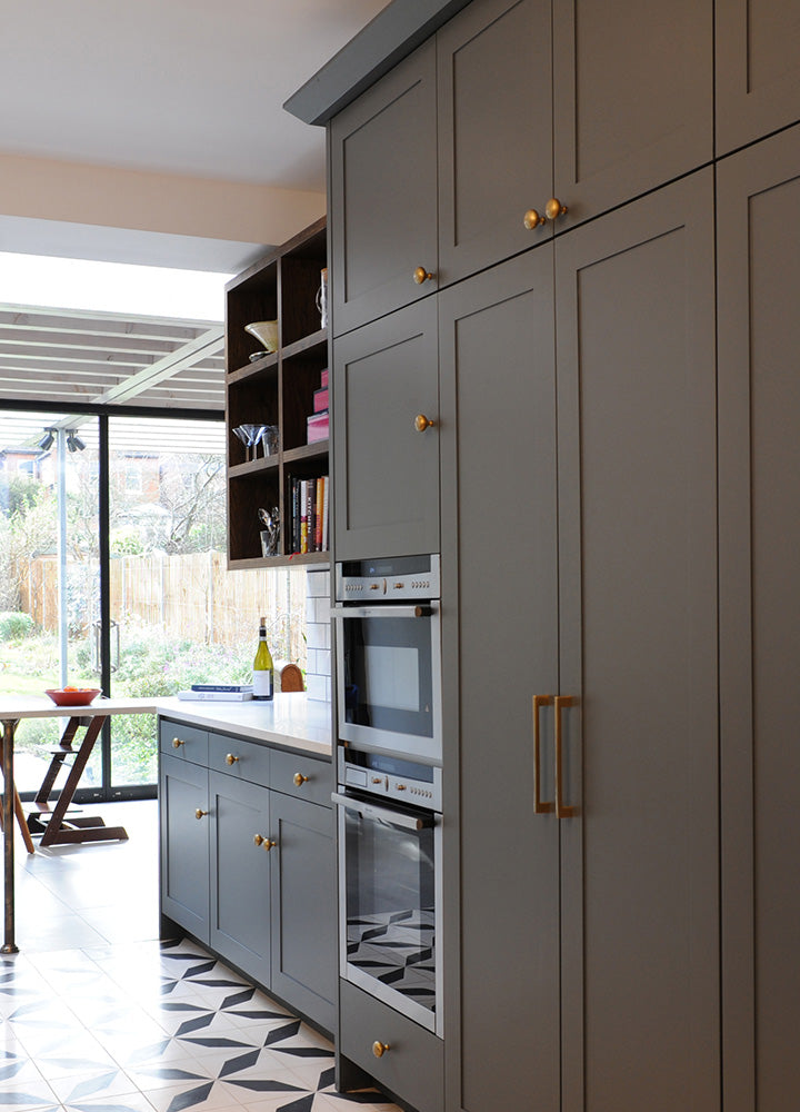 White built-in cupboard fitted with a pair of Plain Shaker doors